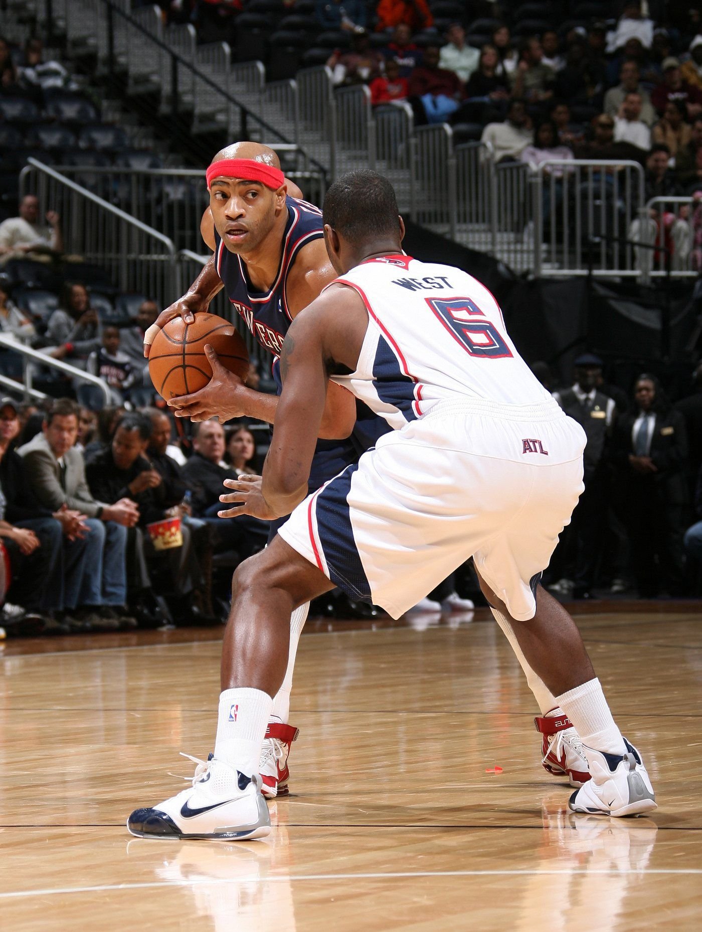 Mario West in a defensive stance against Vince Carter