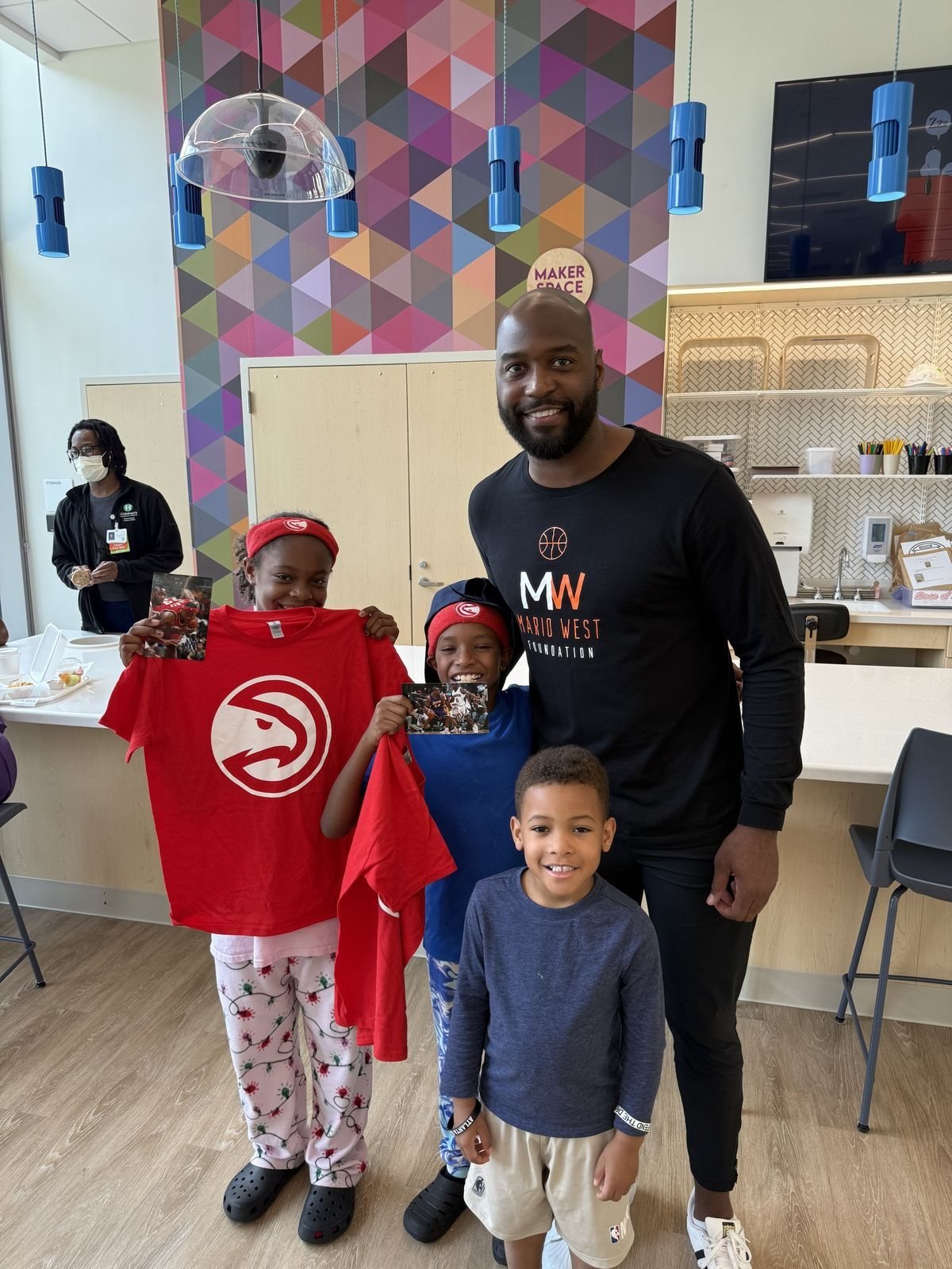 Mario West at a community back to school event