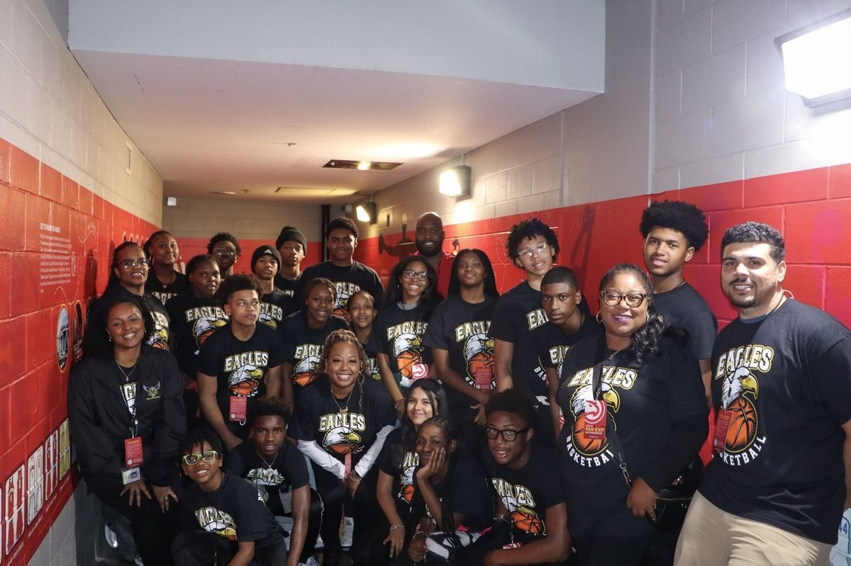 Students at an Atlanta Hawks game with Mario West